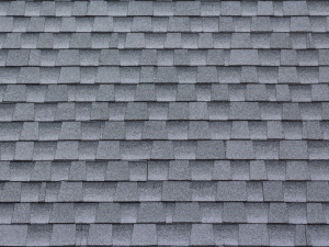 Shingles on a rooftop by Northbay Roofing & Gutter Co., withstanding the effects of summer heat.