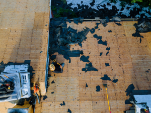 Storm damage roofing crew in Santa Rosa inspecting a roof for repair