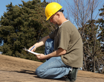 Professional roofing contractor inspecting a roof in Calistoga