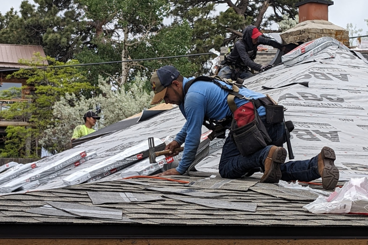 Professional roofers installing a roof in Calistoga