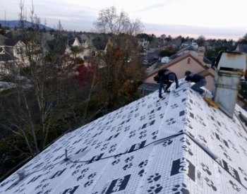 Roofing contractors installing GAF roofing materials on a residential roof in Penngrove