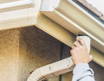 Northbay Roofing technicians performing professional gutter repair on a beautiful home in Kentfield, ensuring effective water drainage and protection against weather damage.